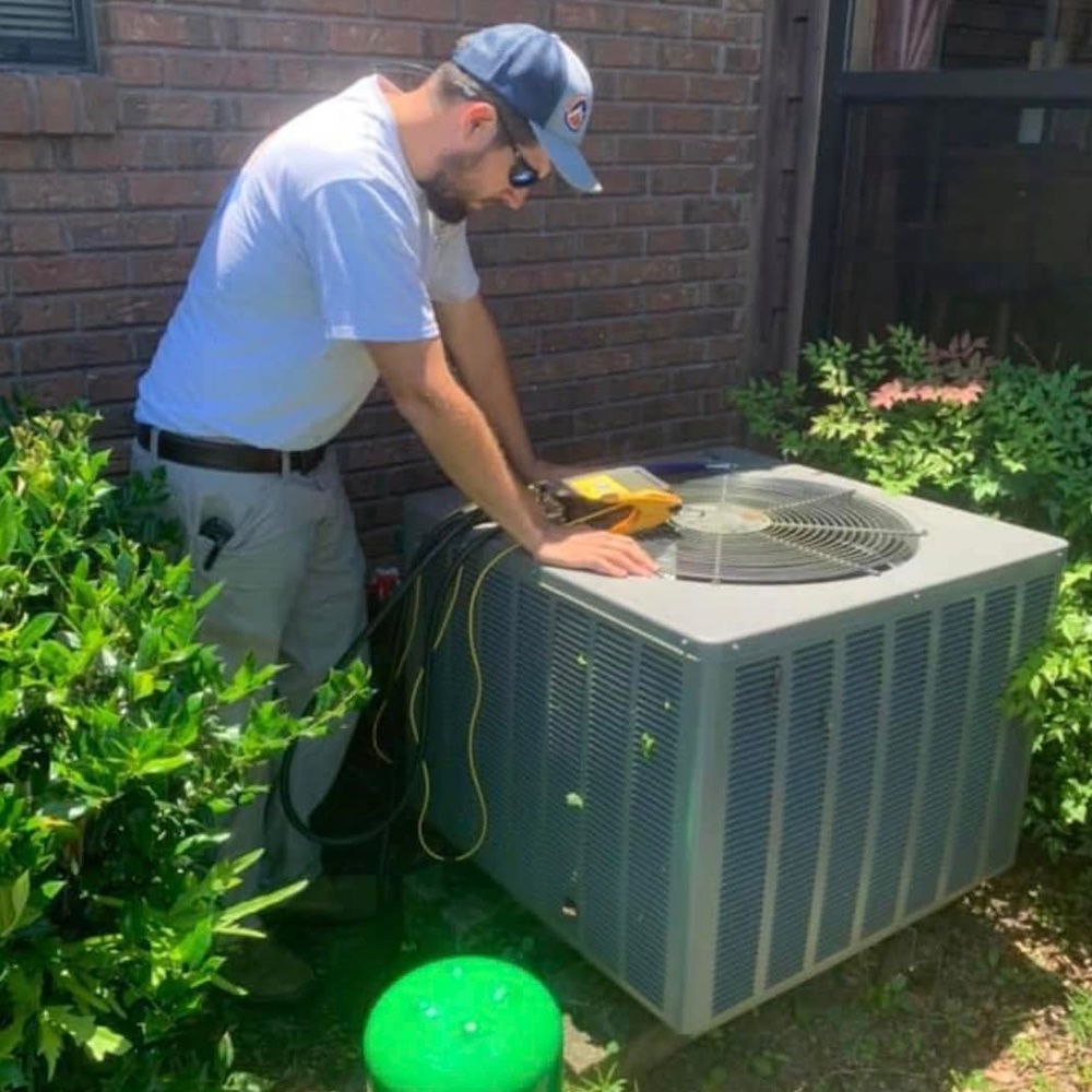 man running diagnostic on ac unit